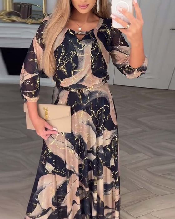 Elegant chiffon dress with a print and three-quarter sleeves